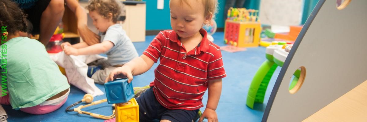 little boy playing with blocks